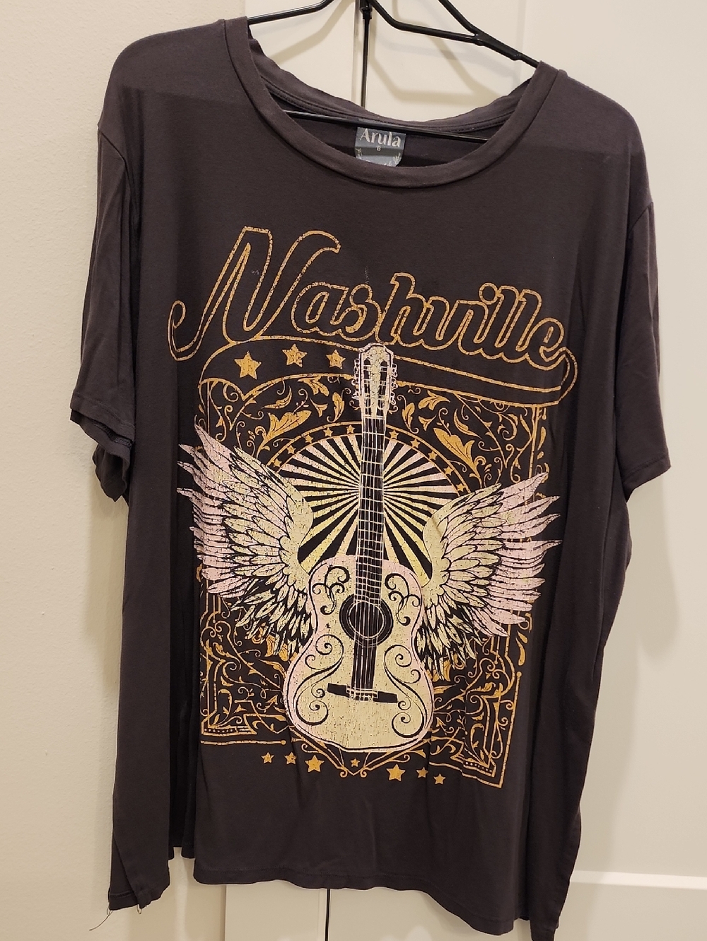 ARULA Black Graphic Tee with Gold and Pink Winged Guitar